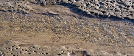 summer photography, hot day, the play of light in the waves on a sandy beach