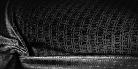 Background texture, pattern. Black silk fabric with a small checkered pattern.の写真素材