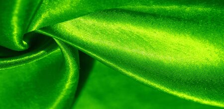 Texture, background, pattern, silk fabric of green color.の写真素材