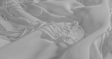 Background, pattern, texture, wallpaper, white silk fabric has a brilliant shine. This is the most...