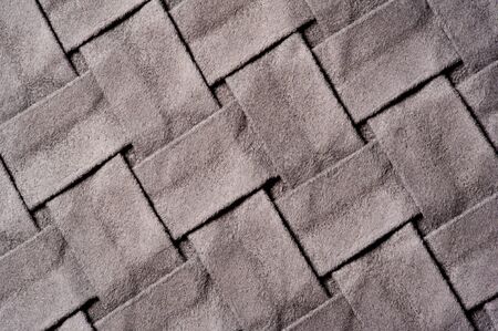 Textured, background, pattern, Woven fabric of intertwined folded strips of gray.の写真素材
