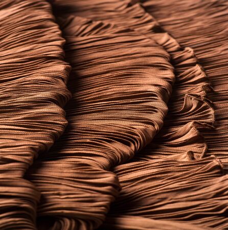 Texture, background, pattern, Fabric gofre brown. Apricot color. Gofre and pleated.
