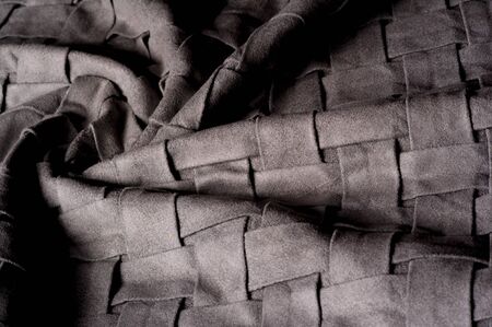 Textured, background, pattern, Woven fabric of intertwined folded strips of gray. Fashionable...