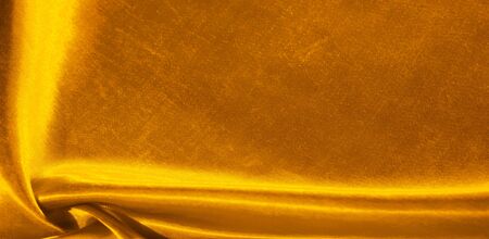 Texture, background, pattern, silk fabric in yellow.の写真素材