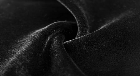 Texture background, pattern. Black Velveteen. This magnificent elastic velor fabric has a velvety nap. Pan pan adds shine and texture! It has a knitted back and is great for your design.の写真素材