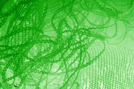 Texture, background, pattern. green tulle. Thin with a heavier weight, insert into your design or add a clean element to the look of your couture!の写真素材