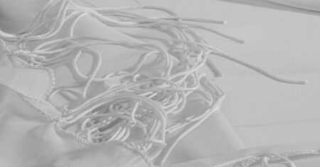 Background, pattern, texture, wallpaper, white silk fabric has a brilliant shine. This is the most...
