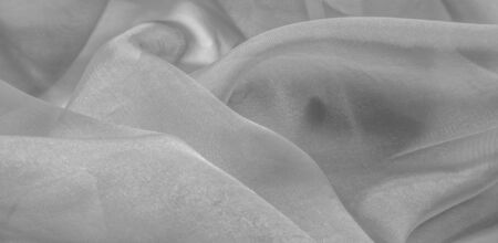 White silk fabric texture pattern. It is also perfect for your design, clothes, posters. Be creative with beautiful project accents. This fabric is inspired by your inspiration.の写真素材