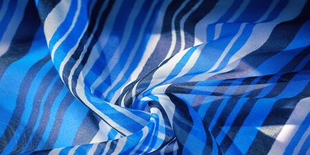 Background texture. multicolored striped silk fabric. Mexican coloring theme bright colored striped pattern with abstract stripesの写真素材