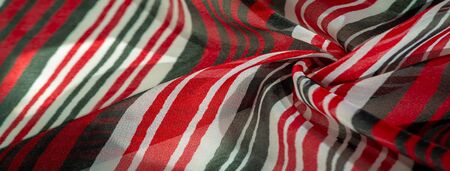 Background texture. multicolored striped silk fabric. Mexican coloring theme bright colored striped...