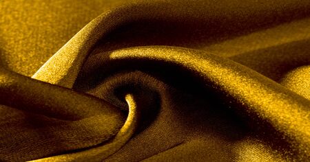 Background, pattern, texture, wallpaper, yellow silk fabric. Add a touch of luxury to any design by adding it to this ultra-soft and very lightweight polyester lining fabric.の写真素材