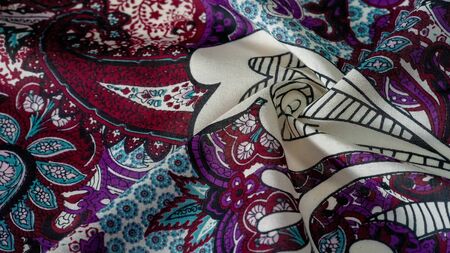 Background texture. cotton women scarf black and white pattern on one side of the scarf and color...