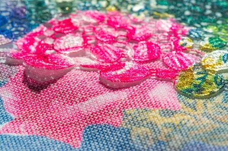 background texture; pattern. Cloth with glued lace stripes. Multicolored lace with sparkles; cording and metallic embroidery. Beautiful traditional lace for designの写真素材