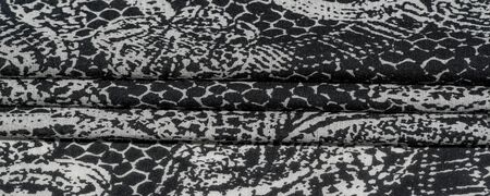 Background texture. cotton women scarf black and white pattern on one side of the scarf and color...