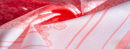 Texture, background, pattern, pink silk fabric on a white background, small flowers pattern...
