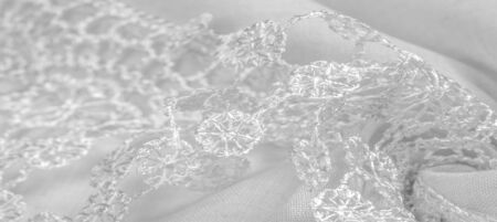 Texture, background, pattern, postcard, silk fabric, female white scarf with lace wrappers. Use these fancy images to create your print and digital materials.の写真素材