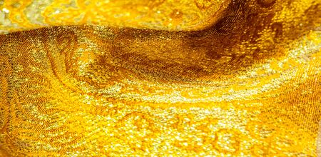 Texture background, pattern. fabric; yellow gold brocade. Organza brocade fabric - shepherd, with a...