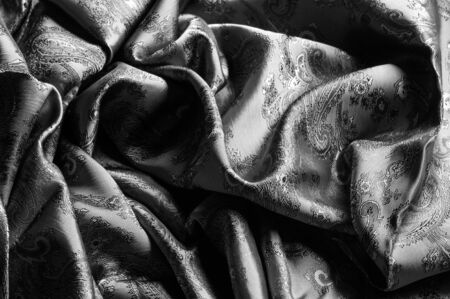 texture, background, black steel gray fabric with a paisley pattern. based on traditional Asian...