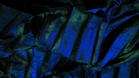 texture background pattern wallpaper silk fabric black with blue emerald stripes, wrinkled fabric,...