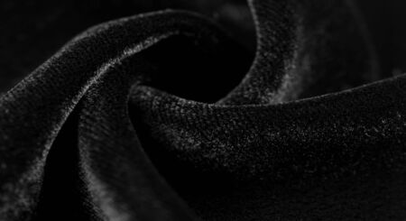 Texture background, pattern. Black Velveteen. This magnificent elastic velor fabric has a velvety nap. Pan pan adds shine and texture! It has a knitted back and is great for your design.の写真素材