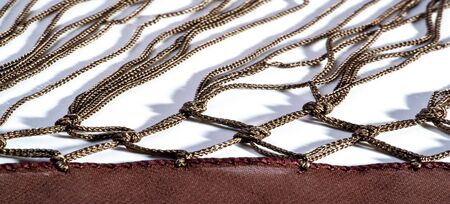 Background texture of silk fabric. This is a natural brown scarf, this beautiful nylon satin made of...