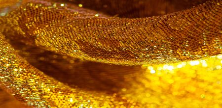 Texture background, pattern. fabric; yellow gold brocade. Organza brocade fabric - shepherd, with a...