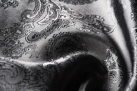 texture, background, black steel gray fabric with a paisley pattern. based on traditional Asian...