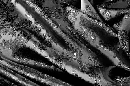 texture, background, black steel gray fabric with a paisley pattern. based on traditional Asian...