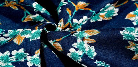 Texture, background, pattern, fabric blue with green colors of flowers. Your possibilities are...