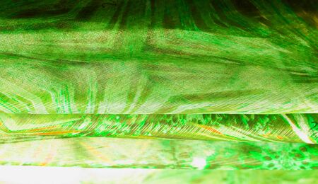 Background texture, pattern. Silk from a greenish emerald shade. This luxurious silk chiffon fabric is a show-stopper. It is clean, has a liquid drape and ultra soft. It is perfect for your design.の写真素材