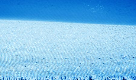 Picture. Texture, background. Blue sapphire silk fabric. This luxurious soft fabric has an ultra-soft and creamy surface with a diverse 10 mm pile of shades of gray.の写真素材