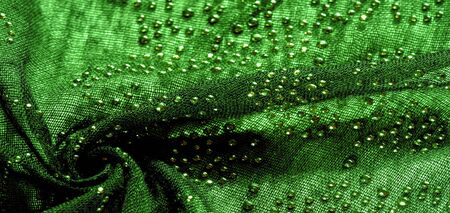 texture, background, pattern, postcard, green emerald silk with glued glass stones to break the light, this fabric is the best fit for your projects, solemnly and stylishlyの写真素材