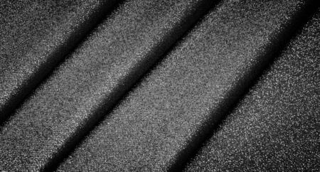 Texture, background, pattern. Cloth Gray black coated with a metallic silver thread. These fabrics are ideal for any project, wallpaper, all design solutions. and many uses of ships.の写真素材