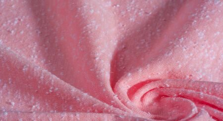 background, pattern, texture, ornament, vintage. pink fabric with artificial pellets. pellet, roll.  this high-quality lightweight stretch cotton jersey knit fabric features a smooth handの写真素材