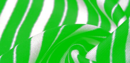 silk striped fabric. green white stripes. This beautiful, super soft, medium-sized silk blend is perfect for your design projects. It is brushed on the back for a luxurious feeling.の写真素材