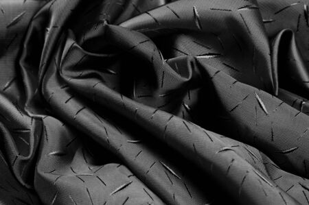 textured, background, drawing, Black silk fabric, Silk fabric Dupioni has a shiny luster and characteristic small blinds that pass horizontally across the fabric.の写真素材