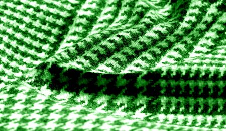 Background texture pattern. The fabric is thick, warm with a checkered pattern green This soft...