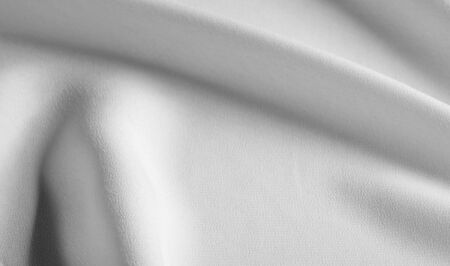 Picture Texture, background Orange silk fabric. It has a wonderful shine with slight color...