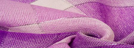 Texture background pattern silk scarf female blue in color with a metal stripe. The scarf is decorated with a delicate patchwork pattern in pastel shades of abstract Scotlandor motifs checked fabricの写真素材