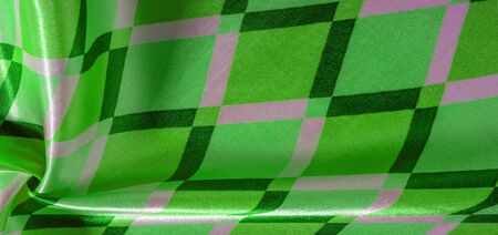 texture background pattern. silk fabric with geometric shapes squares. These figures help to easily...