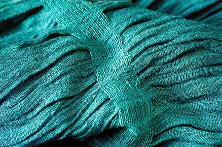 texture, pattern, background. Women's scarf turquoise, harvested material