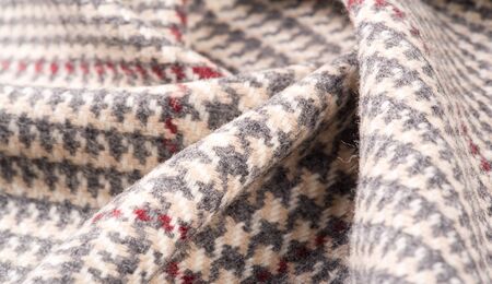 Background texture, pattern. The fabric is thick, warm in a cage, beige. This is 100% wool terry...