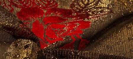 texture, background, pattern, lace with gold sequins Elastic lace pattern from gold strings with lace trim - a wonderful dark gray color with a pink pattern!の写真素材