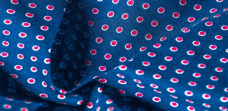 Texture background, pattern, blue silk fabric with red polka dots. Light and silky-soft satin pendant is perfect for your design, online projects. It is also perfect for screensavers and wallpapers.の写真素材