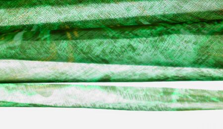 Background texture, pattern. Silk from a greenish emerald shade. This luxurious silk chiffon fabric...