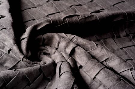 Textured, background, pattern, Woven fabric of intertwined folded strips of gray. Fashionable...
