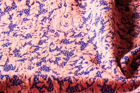 Textured, background, pattern, Fabric wool, on a blue background of beige flowers. depicts a...