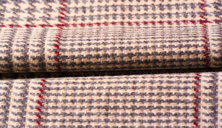 Background texture, pattern. The fabric is thick, warm in a cage, beige. This is 100% wool terry...