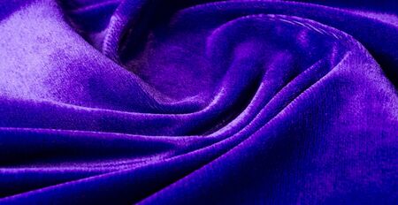 Picture. Texture, background. The velvet fabric is blue, the rich, rich color and luster of this luxurious velvet will add sophistication to any design style..の写真素材