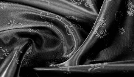 Texture, Black silk chiffon fabric with paisley print. fabulous soft and dark fabric, with a beautiful paisley pattern in gray, it would be just as beautiful for your design, wallpaper, postersの写真素材